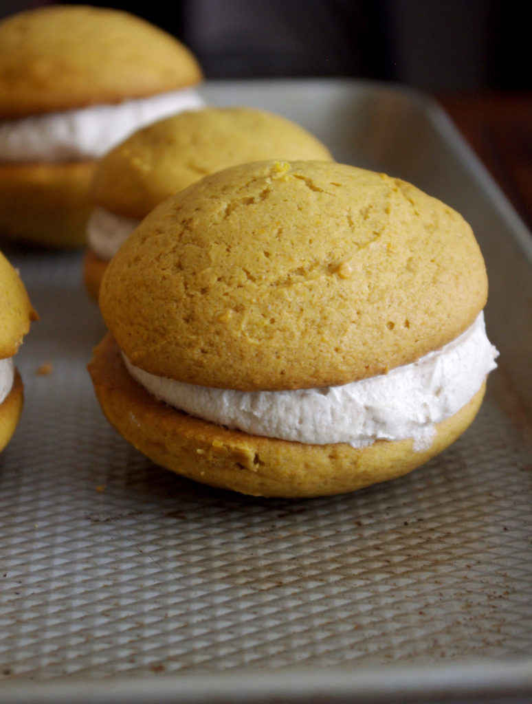 Pumpkin Whoopie Pies with Whipped Cinnamon Filling are soft, pillowy bundles of cinnamon sweetness and pumpkin goodness | www.thebatterthickens.com