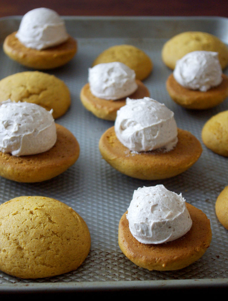 Pumpkin Whoopie Pies with Whipped Cinnamon Filling are soft, pillowy bundles of cinnamon sweetness and pumpkin goodness | www.thebatterthickens.com