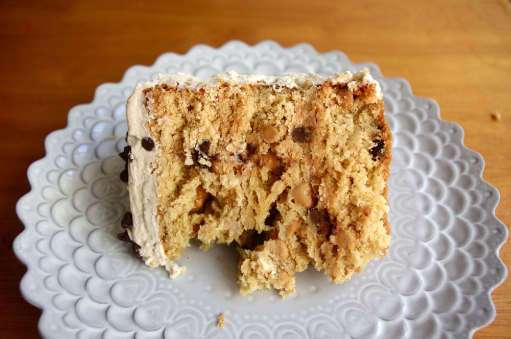 Peanut Butter Chocolate Chip Cookie Dough Cake - three layers of peanut butter cake with chocolate chips, covered in peanut butter cookie dough frosting, a peanut butter lover's fantasy #peanutbutter #chocolatechip #cookiedough #cake | www.thebatterthickens.com