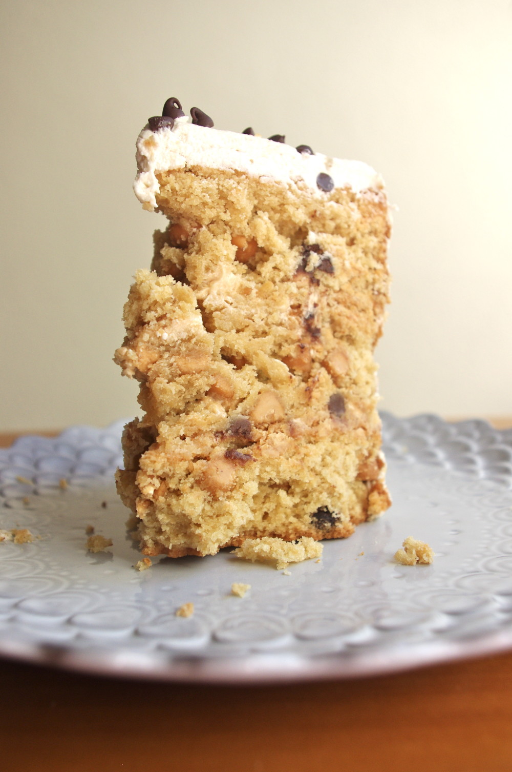 Peanut Butter Chocolate Chip Cookie Dough Cake - three layers of peanut butter cake with chocolate chips, covered in peanut butter cookie dough frosting, a peanut butter lover's fantasy #peanutbutter #chocolatechip #cookiedough #cake | www.thebatterthickens.com