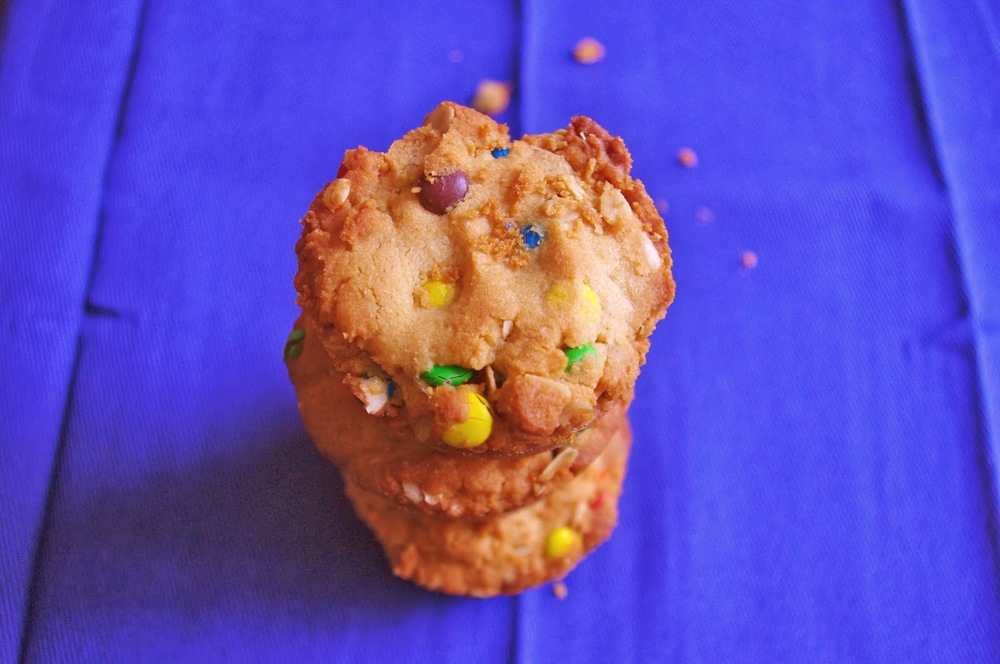 Reese's Stuffed Monster Cookie Cups - thick and chewy monster cookie cups with a mini Reese's stuffed inside | www.thebatterthickens.com