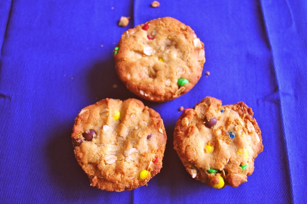 Reese's Stuffed Monster Cookie Cups - thick and chewy monster cookie cups with a mini Reese's stuffed inside | www.thebatterthickens.com