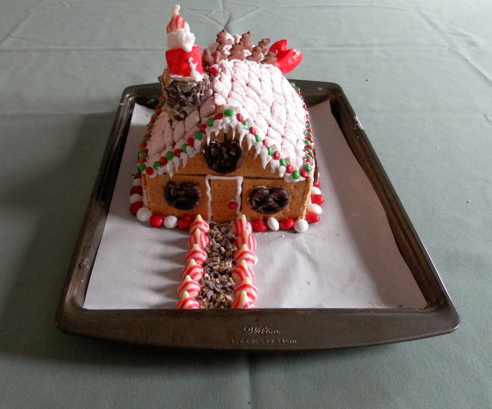 Chocolate Gingerbread House Cake - a gingerbread house built around a solid chocolate gingerbread cake core | www.thebatterthickens.com