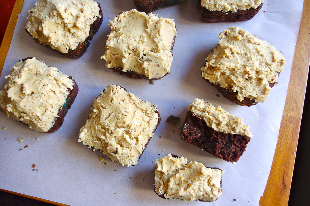 Monster Cookie Brownies - stuffed with peanut butter chips and M&Ms, and covered in peanut butter oatmeal cookie dough frosting #peanutbutter #monstercookies #brownies | www.thebatterthickens.com