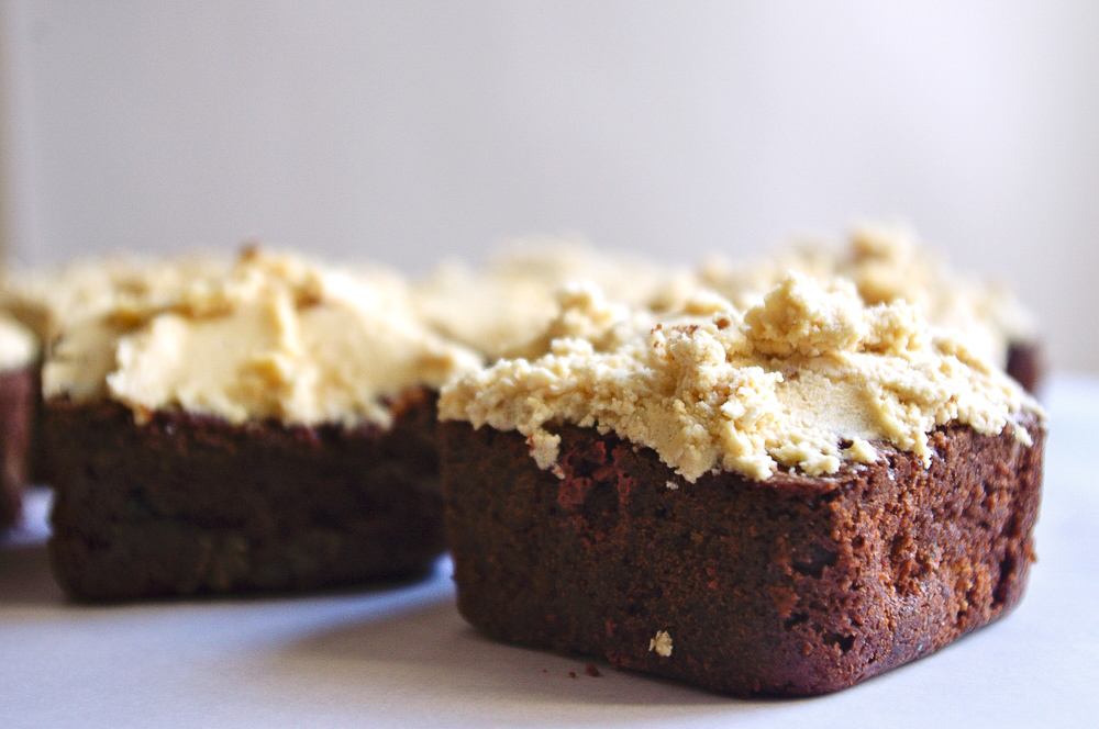 Monster Cookie Brownies - stuffed with peanut butter chips and M&Ms, and covered in peanut butter oatmeal cookie dough frosting #peanutbutter #monstercookies #brownies | www.thebatterthickens.com