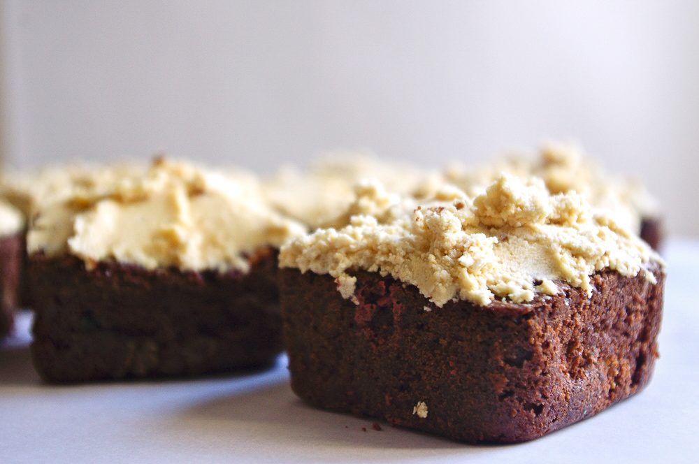 Monster Cookie Brownies - stuffed with peanut butter chips and M&Ms, and covered in peanut butter oatmeal cookie dough frosting #peanutbutter #monstercookies #brownies | www.thebatterthickens.com