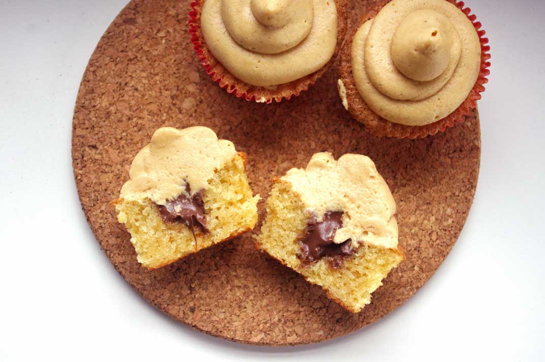 Ritz Cracker Cupcakes -- with peanut butter frosting and nutella filling, these cupcakes are your after school snack dreams brought to life | www.thebatterthickens.com