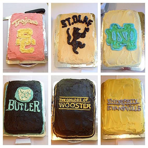 Six graduation cakes decorated with college logos