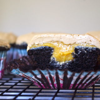 Pumpkin Mocha Cupcakes - moist chocolate cupcakes filled with pumpkin ganache and frosted with a coffee buttercream #pumpkin #cupcakes #mocha | www.thebatterthickens.com