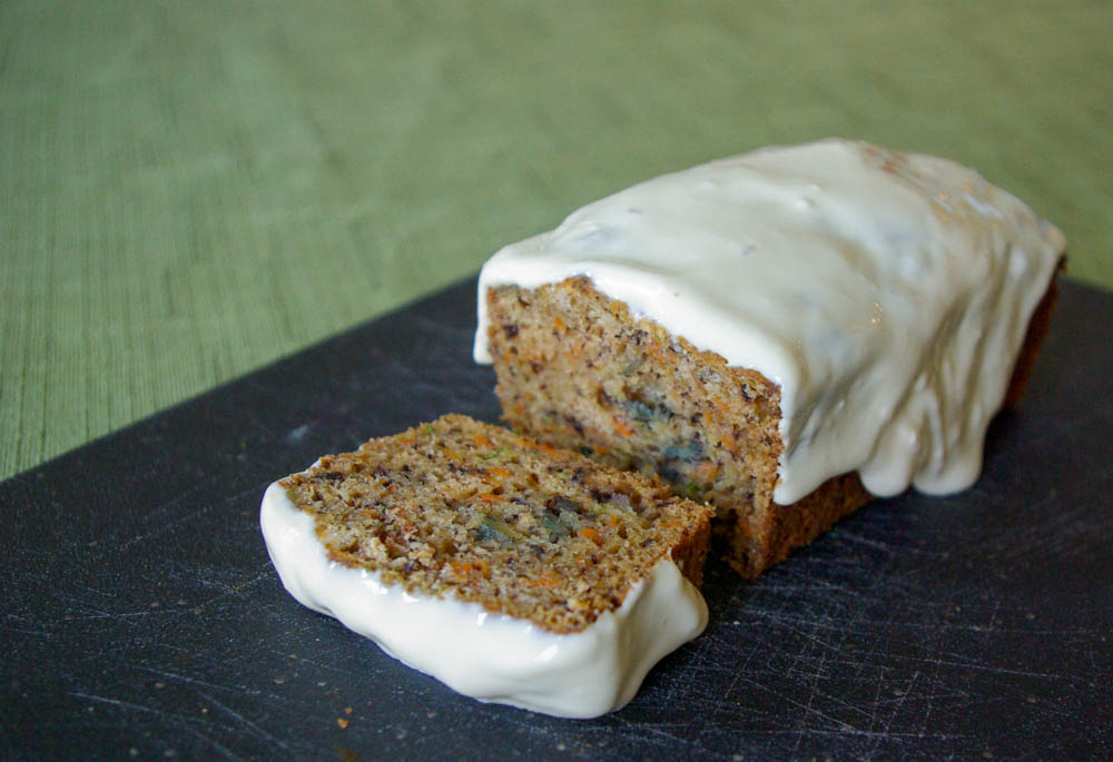 Carrot Zucchini Bread - carrots add an extra sweetness to this moist zucchini bread, topped with luscious maple cream cheese glaze #quickbread #zucchinibread #zucchini #carrot | www.thebatterthickens.com