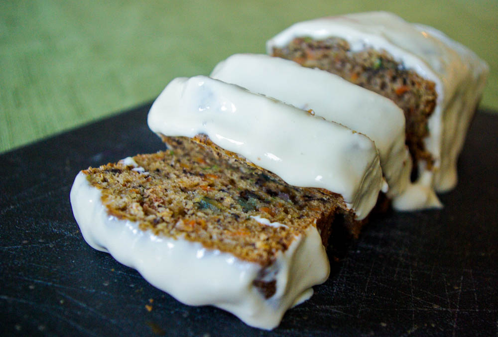 Carrot Zucchini Bread - carrots add an extra sweetness to this moist zucchini bread, topped with luscious maple cream cheese glaze #quickbread #zucchinibread #zucchini #carrot | www.thebatterthickens.com