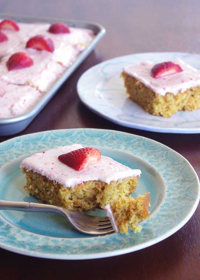 Coconut Carrot Sheet Cake with Strawberry Mascarpone Frosting | A moist carrot cake made with coconut and topped with a sweet, tart strawberry mascarpone frosting | www.thebatterthickens.com