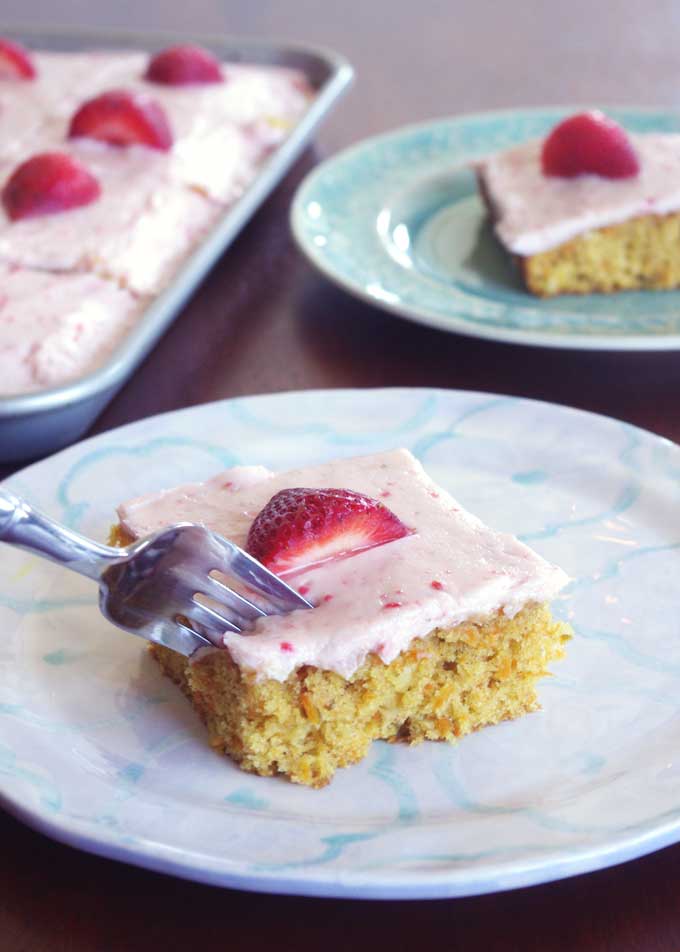 Coconut Carrot Sheet Cake with Strawberry Mascarpone Frosting | A moist carrot cake made with coconut and topped with a sweet, tart strawberry mascarpone frosting | www.thebatterthickens.com