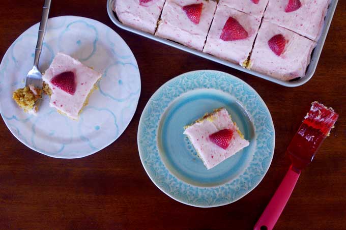 Coconut Carrot Sheet Cake with Strawberry Mascarpone Frosting | A moist carrot cake made with coconut and topped with a sweet, tart strawberry mascarpone frosting | www.thebatterthickens.com