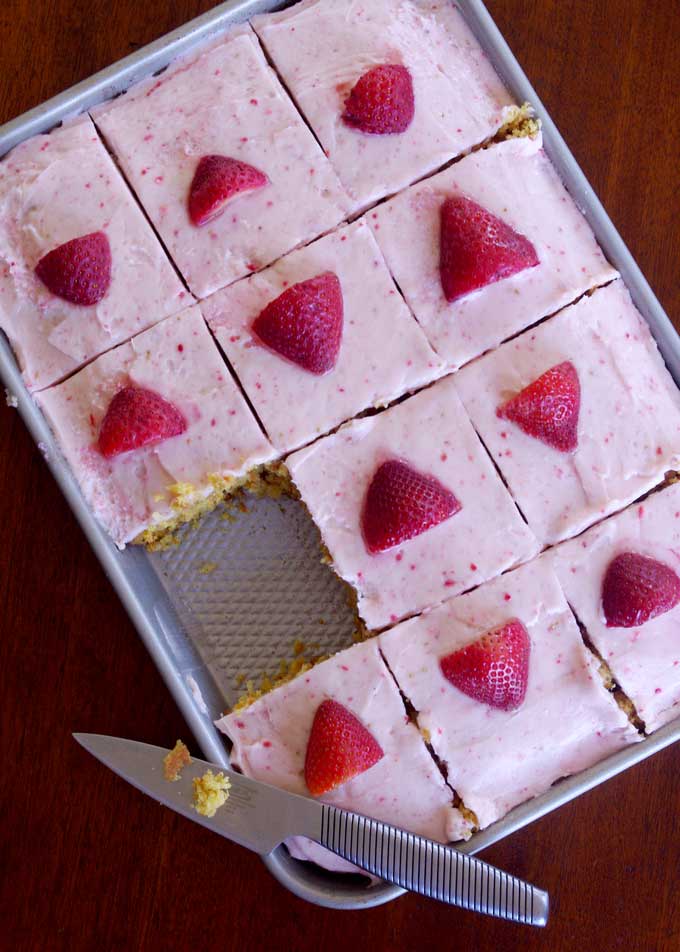 Coconut Carrot Sheet Cake with Strawberry Mascarpone Frosting | A moist carrot cake made with coconut and topped with a sweet, tart strawberry mascarpone frosting | www.thebatterthickens.com