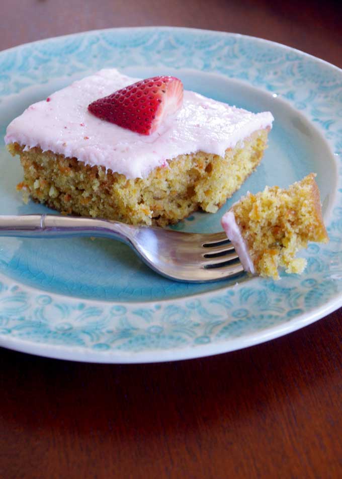 Coconut Carrot Sheet Cake with Strawberry Mascarpone Frosting | A moist carrot cake made with coconut and topped with a sweet, tart strawberry mascarpone frosting | www.thebatterthickens.com