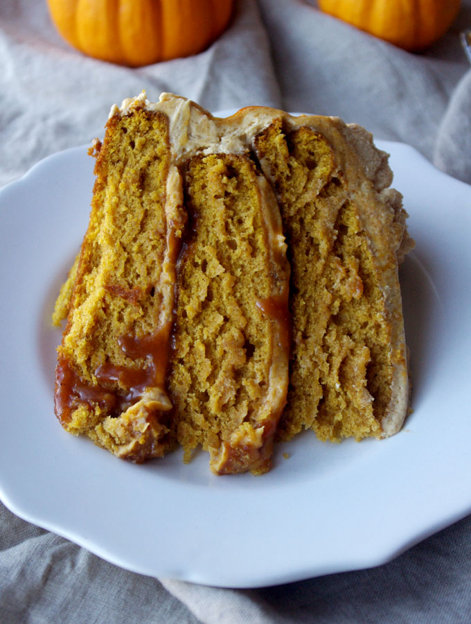 Pumpkin Spice Overdose Cake - 3 layers of soft pumpkin cake filled with pumpkin ganache and pumpkin salted caramel with pumpkin frosting and decorated with pumpkin whipped cream, aka ALL THE PUMPKIN! | www.thebatterthickens.com 