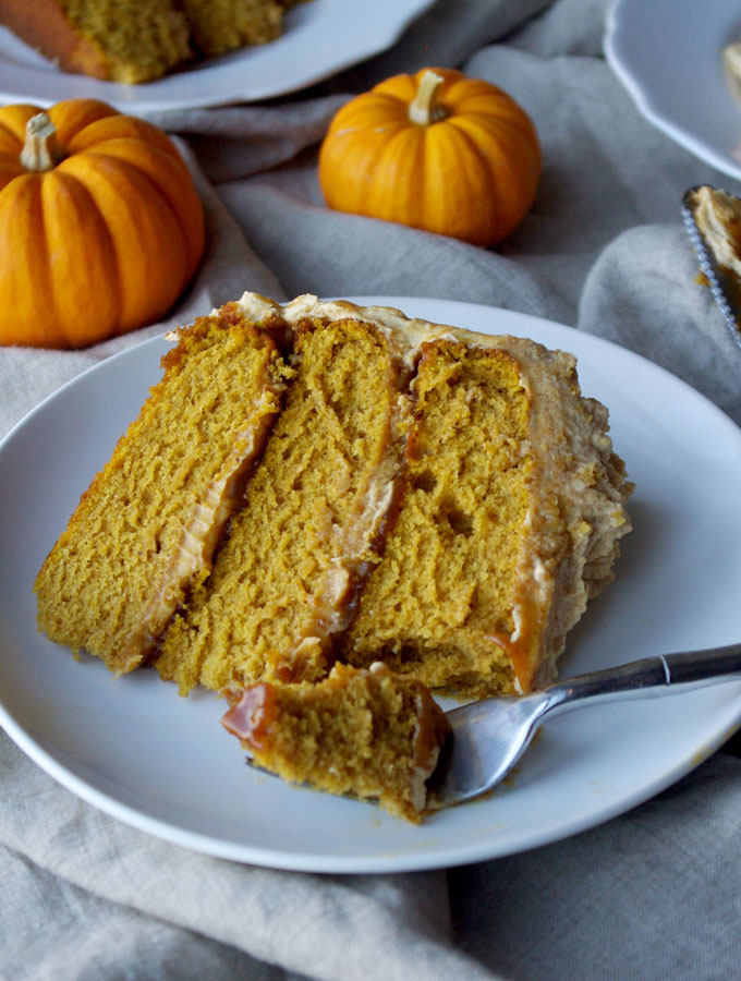 Pumpkin Spice Overdose Cake - 3 layers of soft pumpkin cake filled with pumpkin ganache and pumpkin salted caramel with pumpkin frosting and decorated with pumpkin whipped cream, aka ALL THE PUMPKIN! | www.thebatterthickens.com 