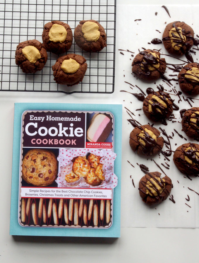 Buckeye Thumbprint Cookies - dense chocolate cookie base topped with a sweet peanut peanut butter ball and drizzled with bittersweet chocolate | www.thebatterthickens.com