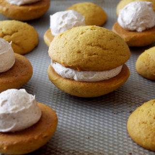 Pumpkin Whoopie Pies with Whipped Cinnamon Filling are soft, pillowy bundles of cinnamon sweetness and pumpkin goodness | www.thebatterthickens.com