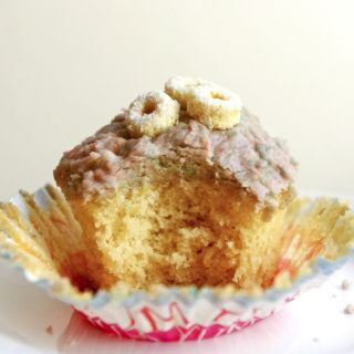Fruit Loops Cupcakes - All part of a complete breakfast! With Fruit Loops blended right into the frosting, one bite will instantly transport you back to childhood (or delight your kiddos!) #cupcakes #fruitloops #cereal #kidsbaking #dessert #bakingrecipe | www.thebatterthickens.com