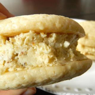 Lemon Pistachio Ice Cream Sandwiches - lemon whoopie pies sandwiched around pistachio ice cream #lemon #icecreamsandwich #pistachio | www.thebatterthickens.com