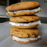 Brown Butter Coconut Chocolate Whoopie Pies - soft-baked brown butter whoopie pies sandwiched around chocolate ganache and coconut frosting #brownbutter #whoopiepies #samoa | www.thebatterthickens.com