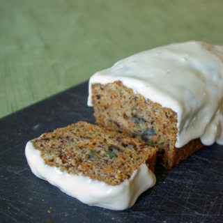 Carrot Zucchini Bread - carrots add an extra sweetness to this moist zucchini bread, topped with luscious maple cream cheese glaze #quickbread #zucchinibread #zucchini #carrot | www.thebatterthickens.com