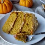 Pumpkin Spice Overdose Cake - 3 layers of soft pumpkin cake filled with pumpkin ganache and pumpkin salted caramel with pumpkin frosting and decorated with pumpkin whipped cream, aka ALL THE PUMPKIN! | www.thebatterthickens.com